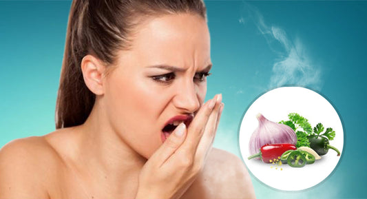A woman smells her bad breath.