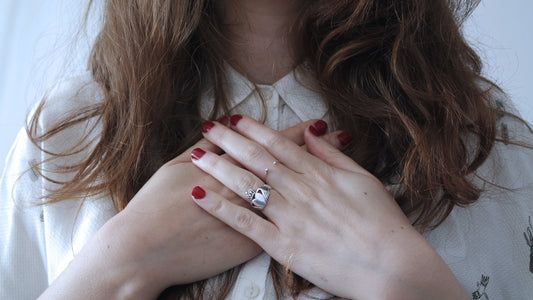 woman holding her chest