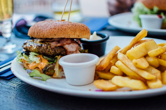 A big plate of beef and fries.