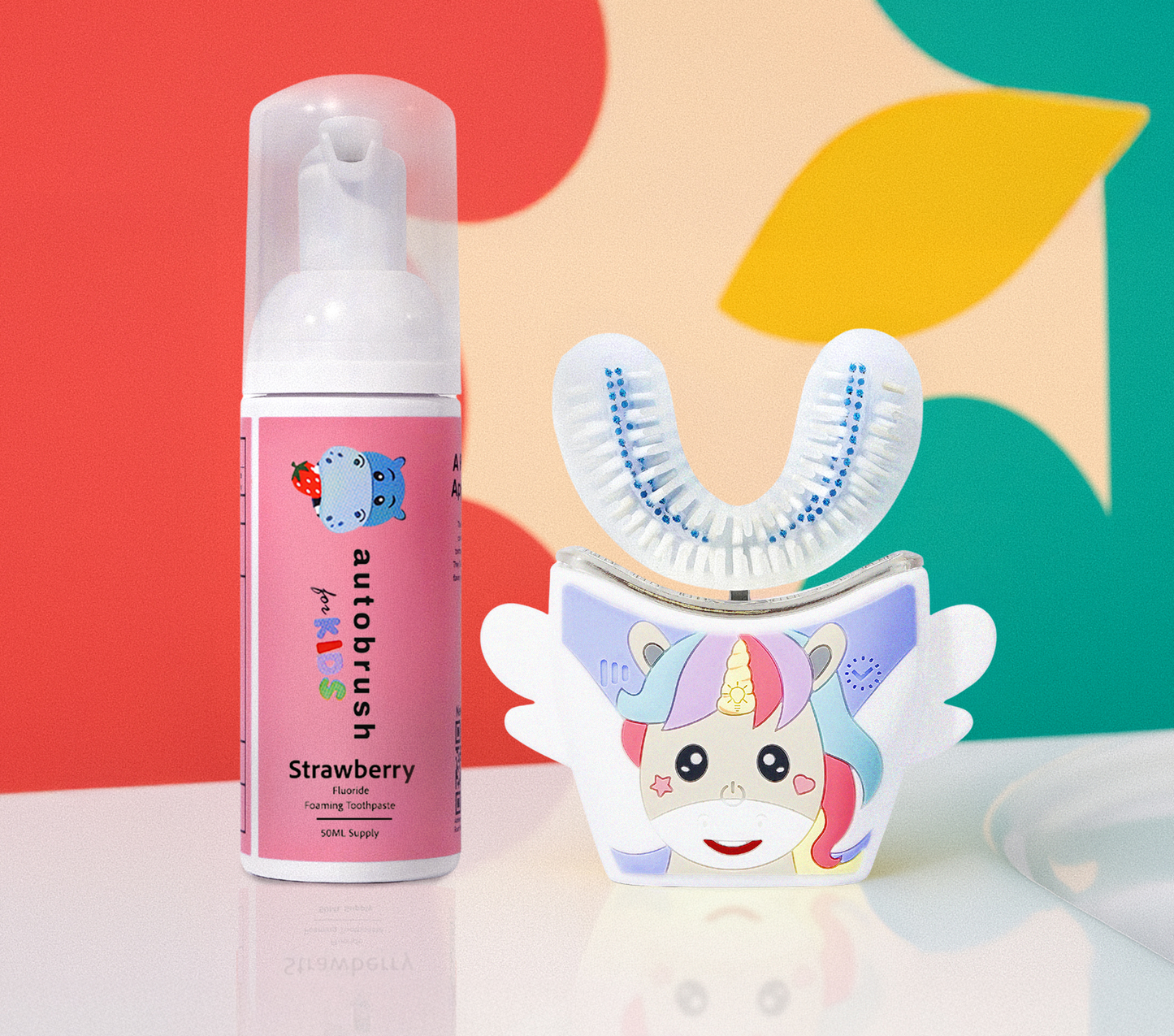 Automated toothbrush and strawberry-flavored mouthwash bottle with colorful background. #sonicprokidsbundle