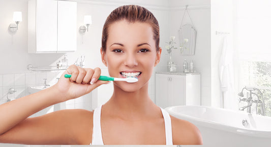 Person brushing her teeth.