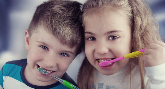 Kids brushing their teeth.