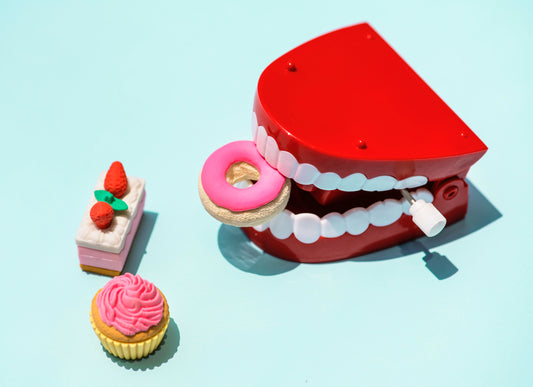 Toy dentures biting into toy desserts, for AutoBrush