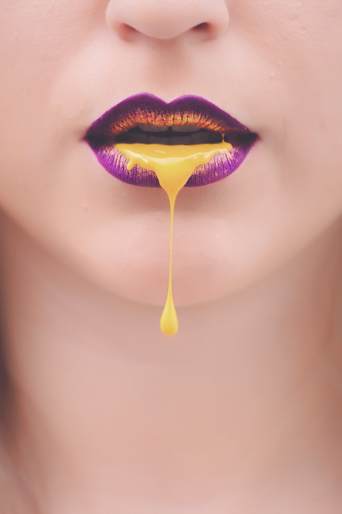 Woman with purple lips dripping yellow liquid, for AutoBrush