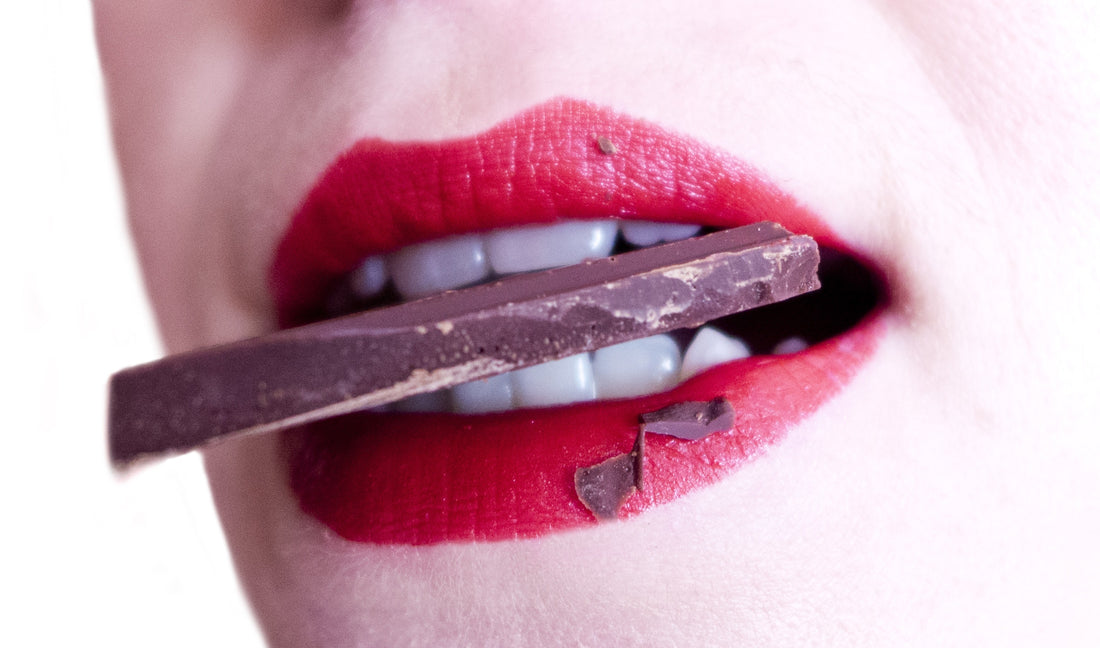Woman biting a piece of chocolate, for AutoBrush