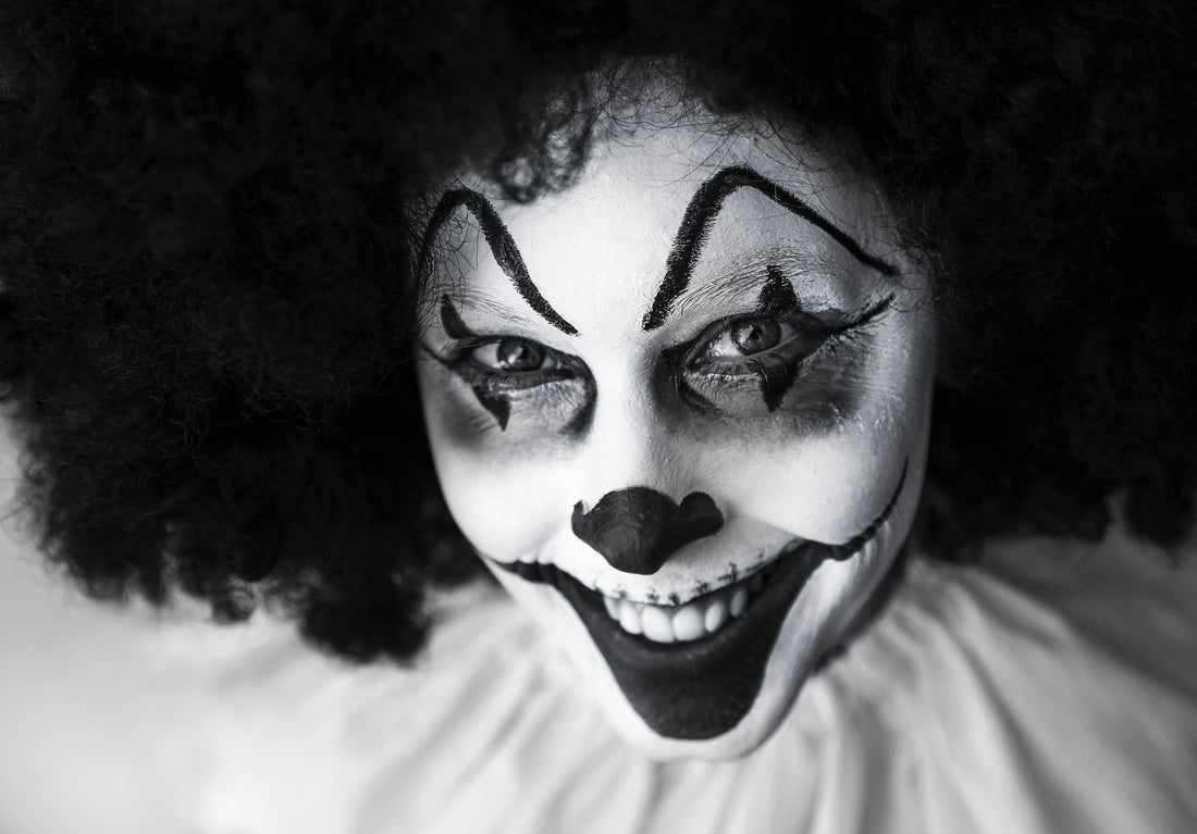 Black and white image of a creepy grinning clown, for AutoBrush