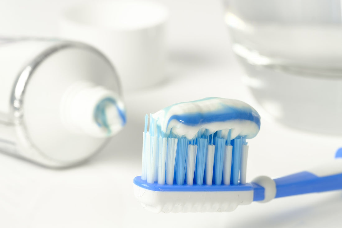 Blue and white toothbrush and toothpaste on white background, for AutoBrush
