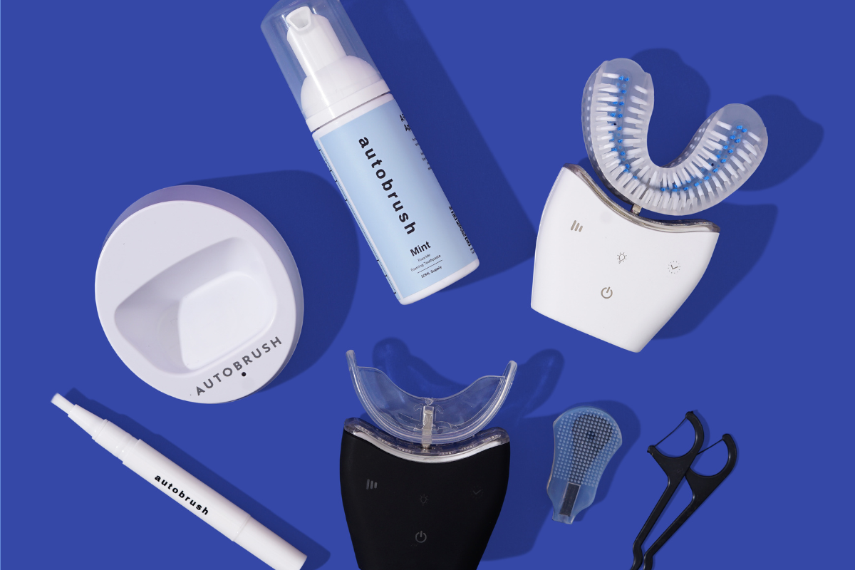 Collection of dental care products and other tools on a blue background.