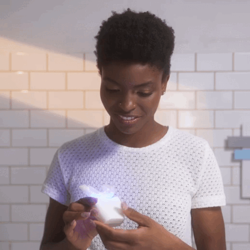 Woman brushing with the Autobrush