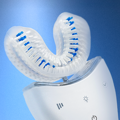 White dental device with blue bristles on a blue background