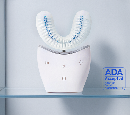 White dental electric brush on a clear surface with a light gray background. Sonic pro brush PDP image. #sonicpro