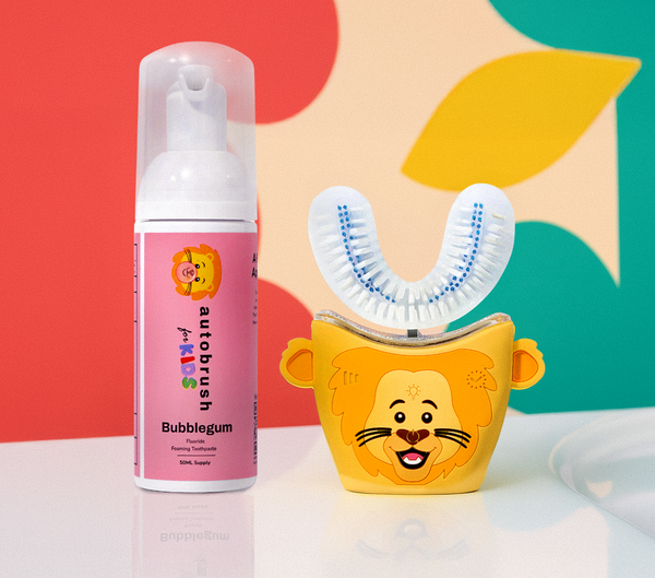Automated toothbrush and toothpaste with lion design on a colorful background. #sonicprokidsbundle