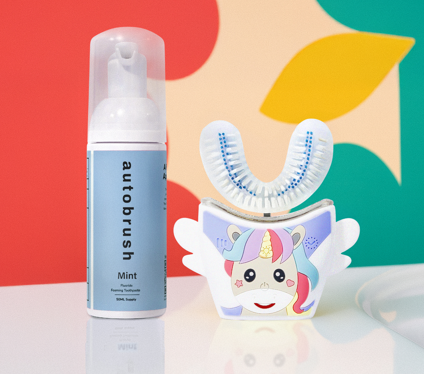 Autobrush mint dental product with a colorful unicorn design on a multicolored background. #sonicprokidsbundle