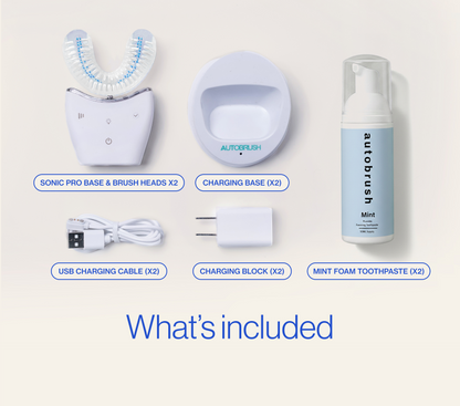 Collection of Autobrush dental care products including base, brush heads, charging base, USB cable, charging block, and mint foam toothpaste on a white background. #partnerpack