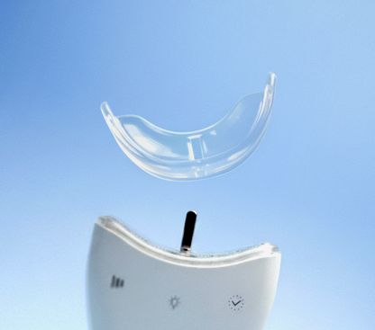 Clear dental retainer on a blue background.  #whiteningg